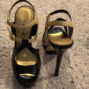 Black and gold Bebe heels